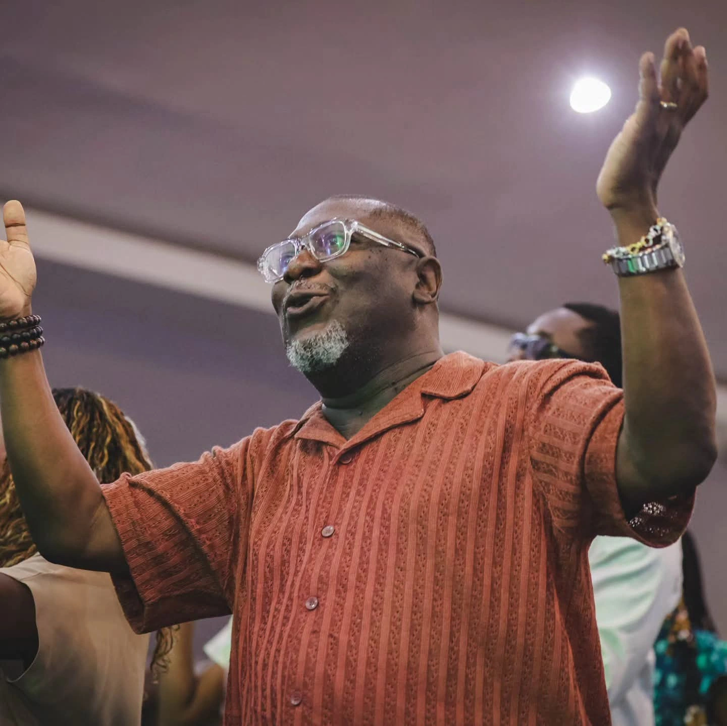Believer wearing the Jerusalem Bracelet in worship